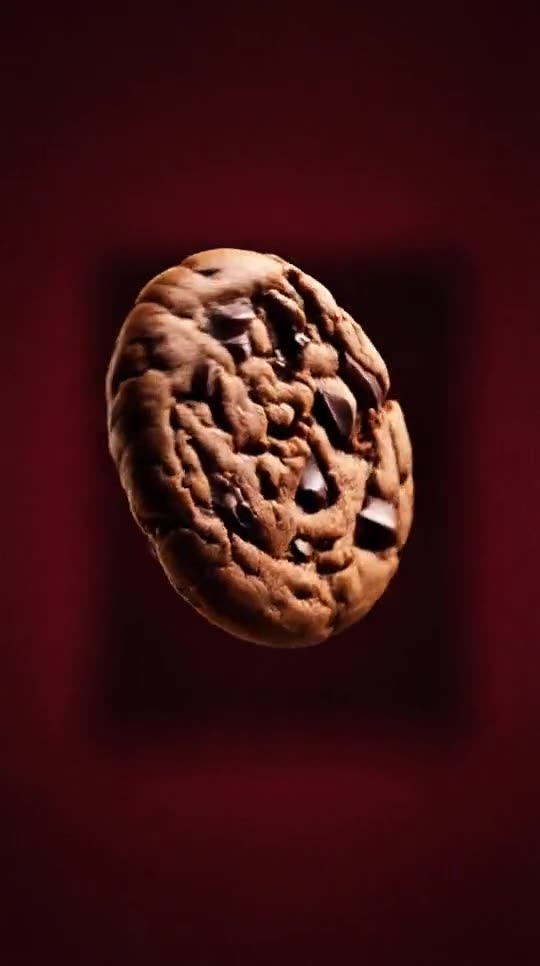 Frame from an AI product film of a chocolate cookie